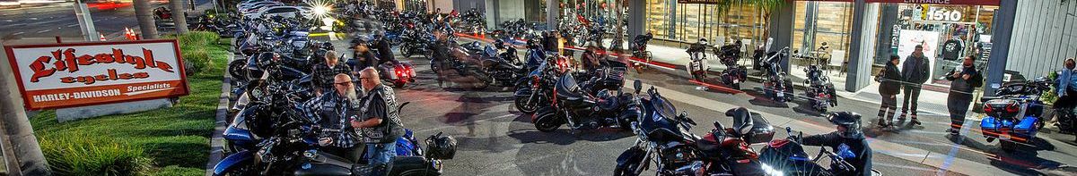 Riders and Harley-Davidson bikes outside the Lifestyle Cycles storefront